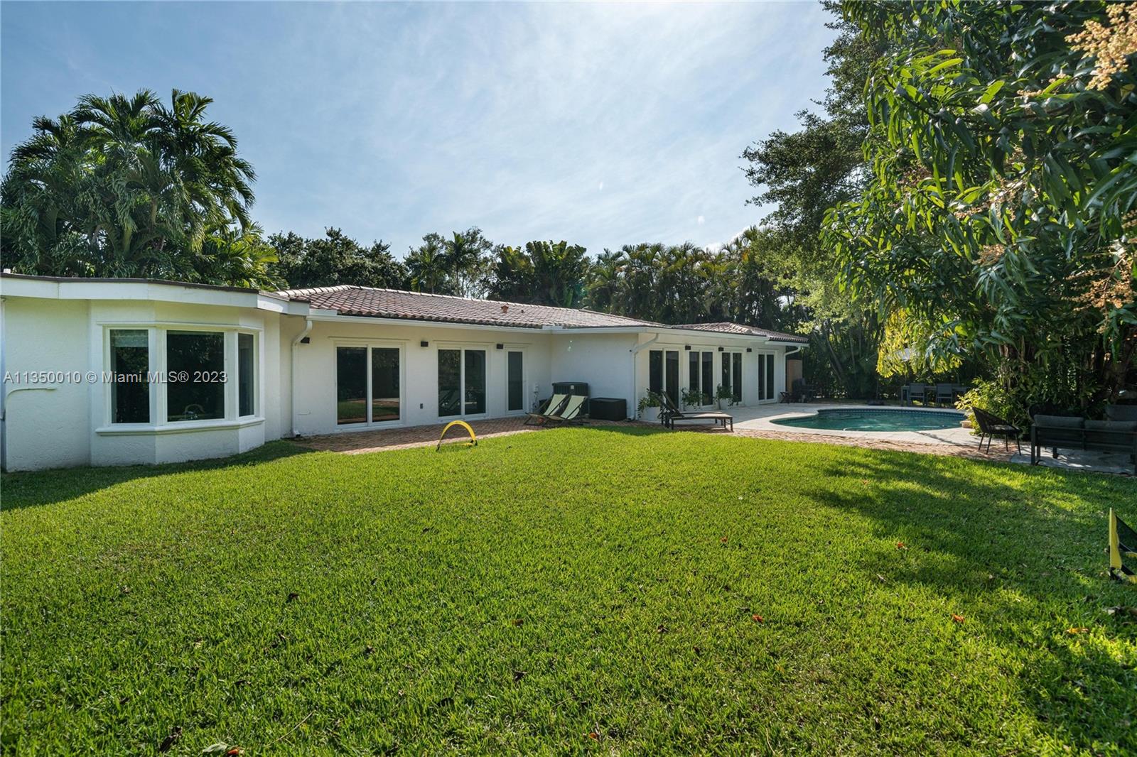 441 Miller Road Coral Gables, FL 33146 - Photo 3 of 34 a view of a house with a swimming pool