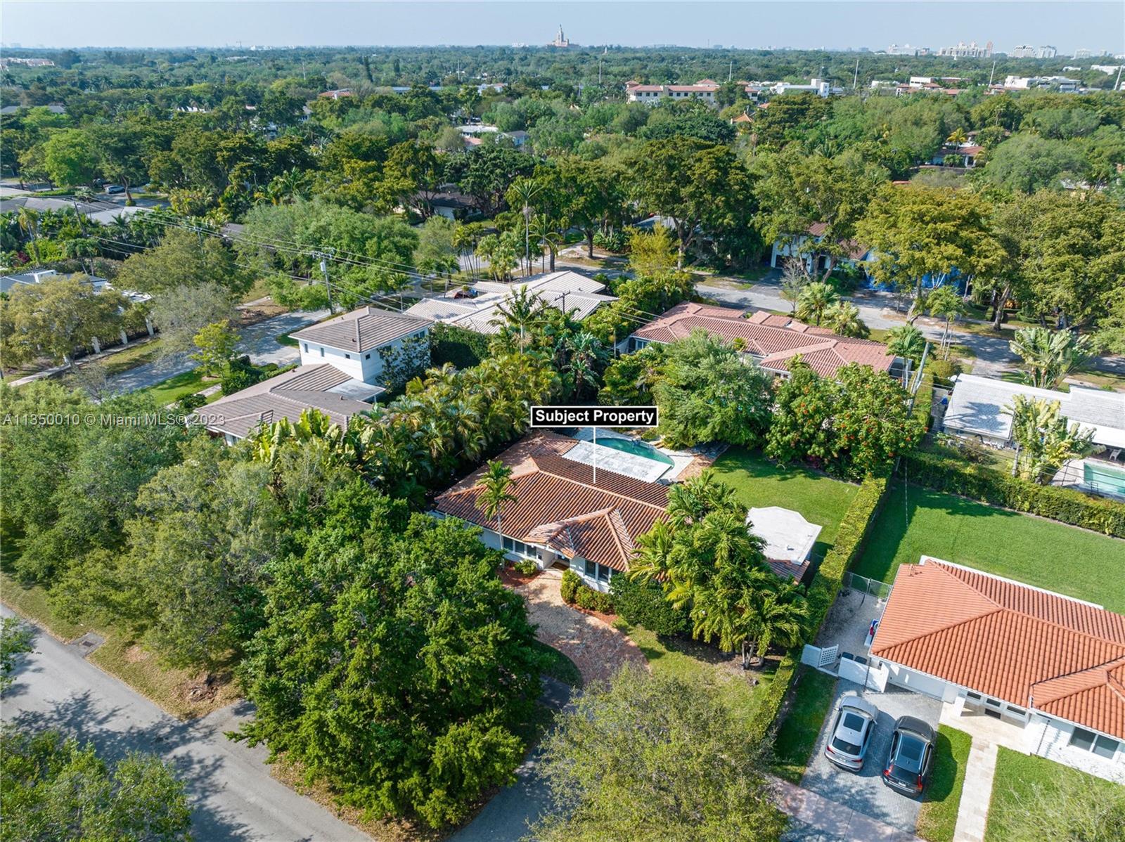 441 Miller Road Coral Gables, FL 33146 - Photo 32 of 34 an aerial view of residential houses with outdoor space and trees all around