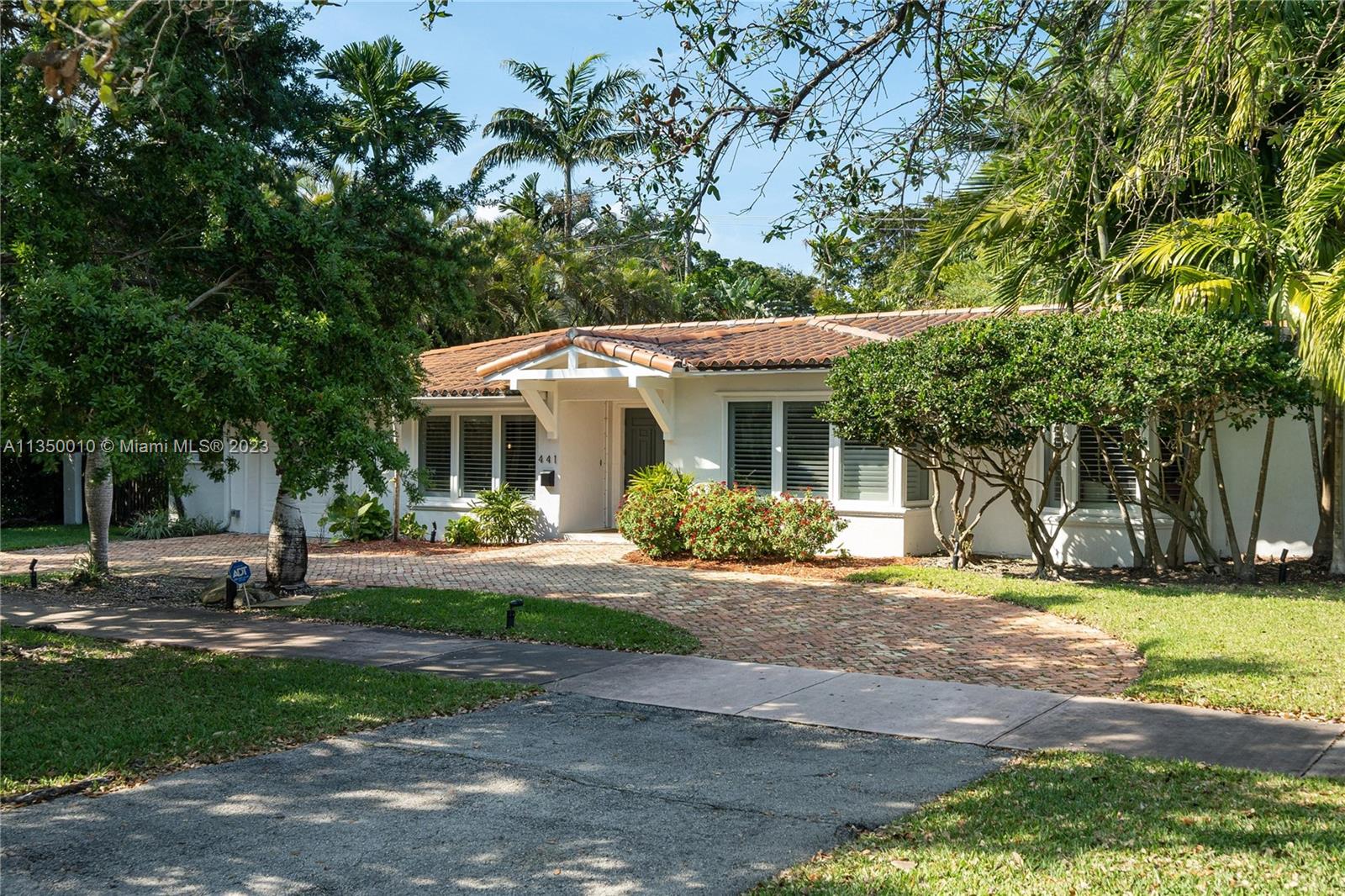 441 Miller Road Coral Gables, FL 33146 - Photo 34 of 34 a front view of a house with a yard