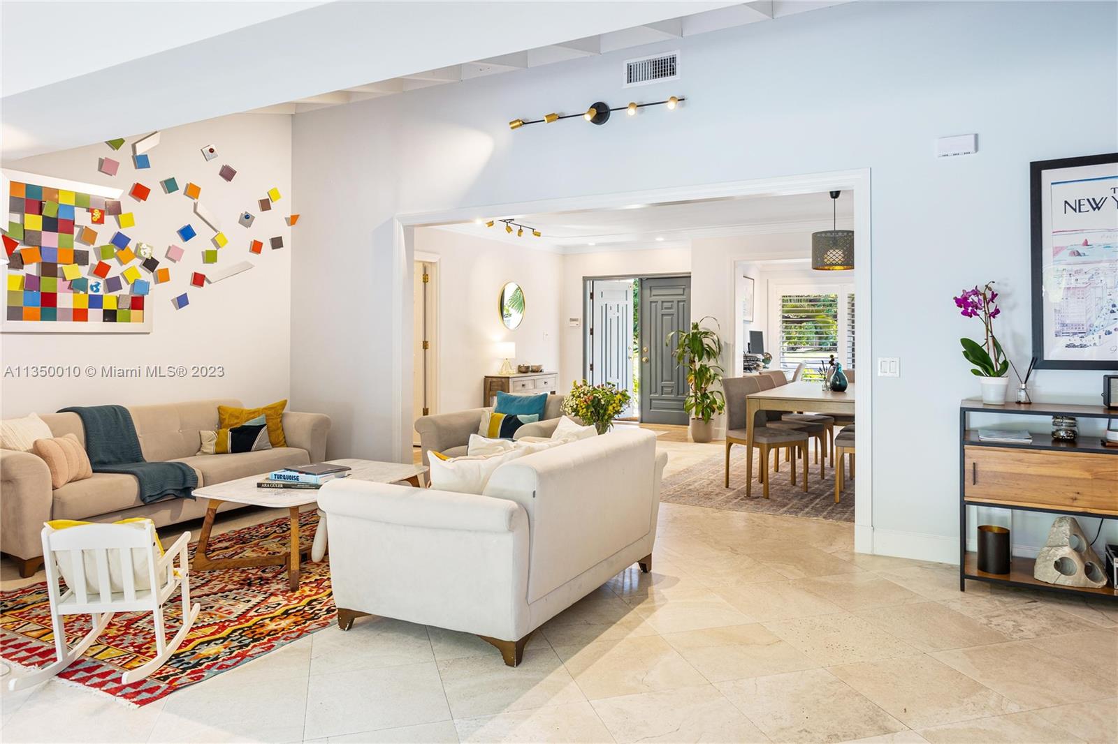 441 Miller Road Coral Gables, FL 33146 - Photo 5 of 34 a living room with furniture and a painting on the wall