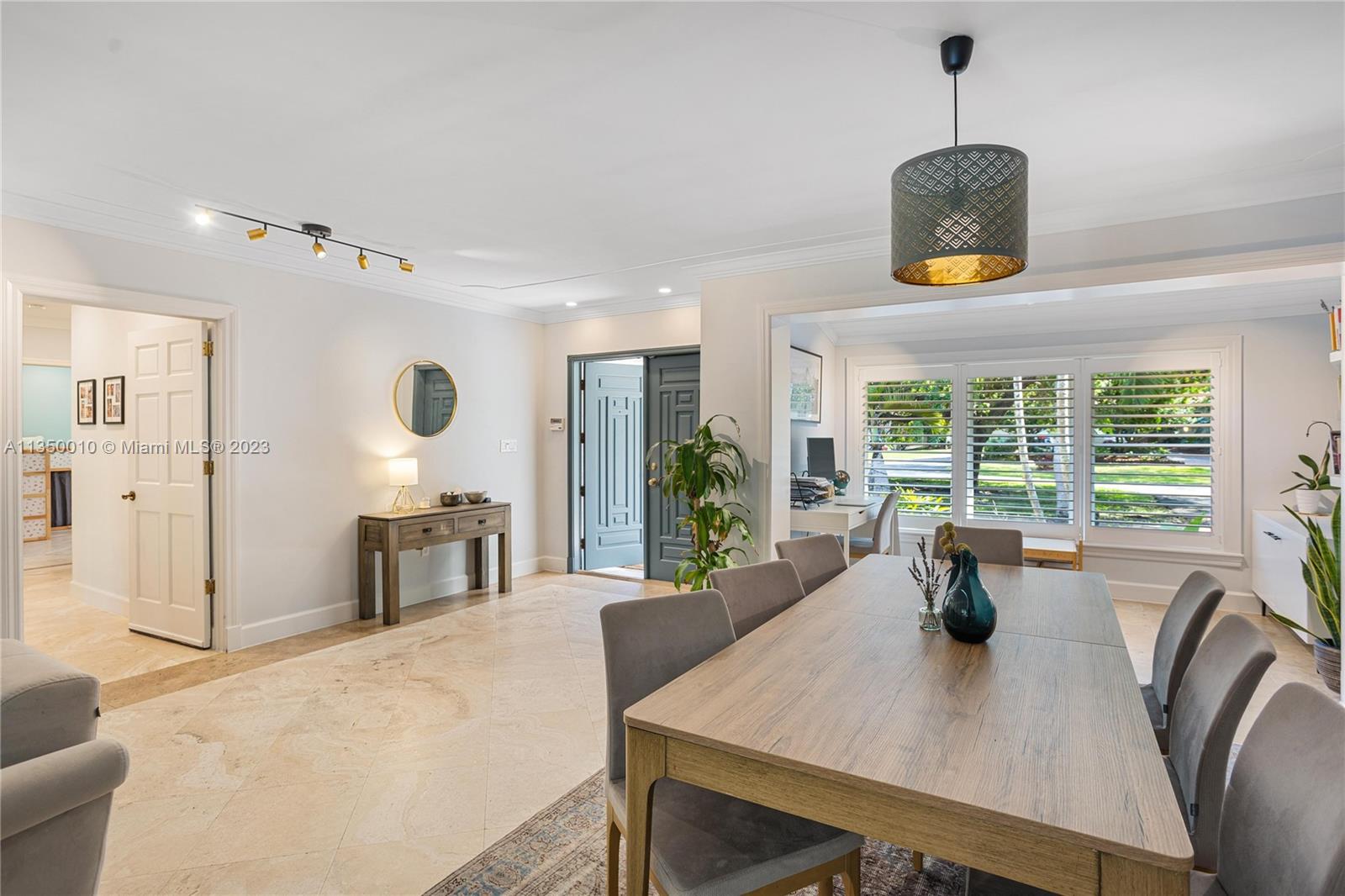 441 Miller Road Coral Gables, FL 33146 - Photo 7 of 34 a view of a dining room with furniture window and outside view