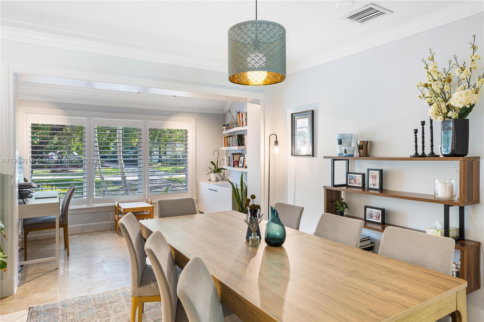 441 Miller Road Coral Gables, FL 33146 - Photo 8 of 34 a dining room with furniture and a large window