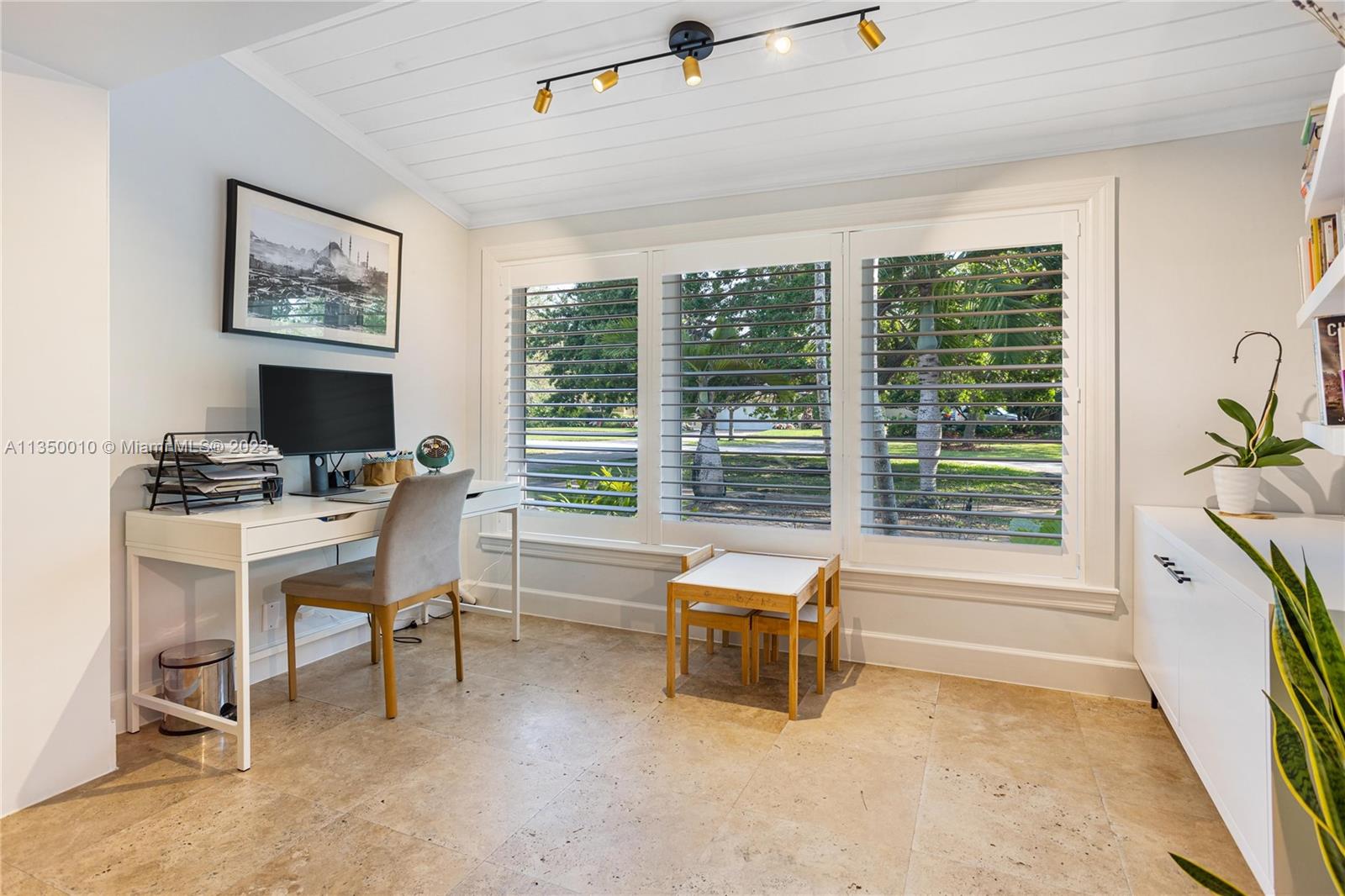 441 Miller Road Coral Gables, FL 33146 - Photo 9 of 34 a workspace with furniture and a window