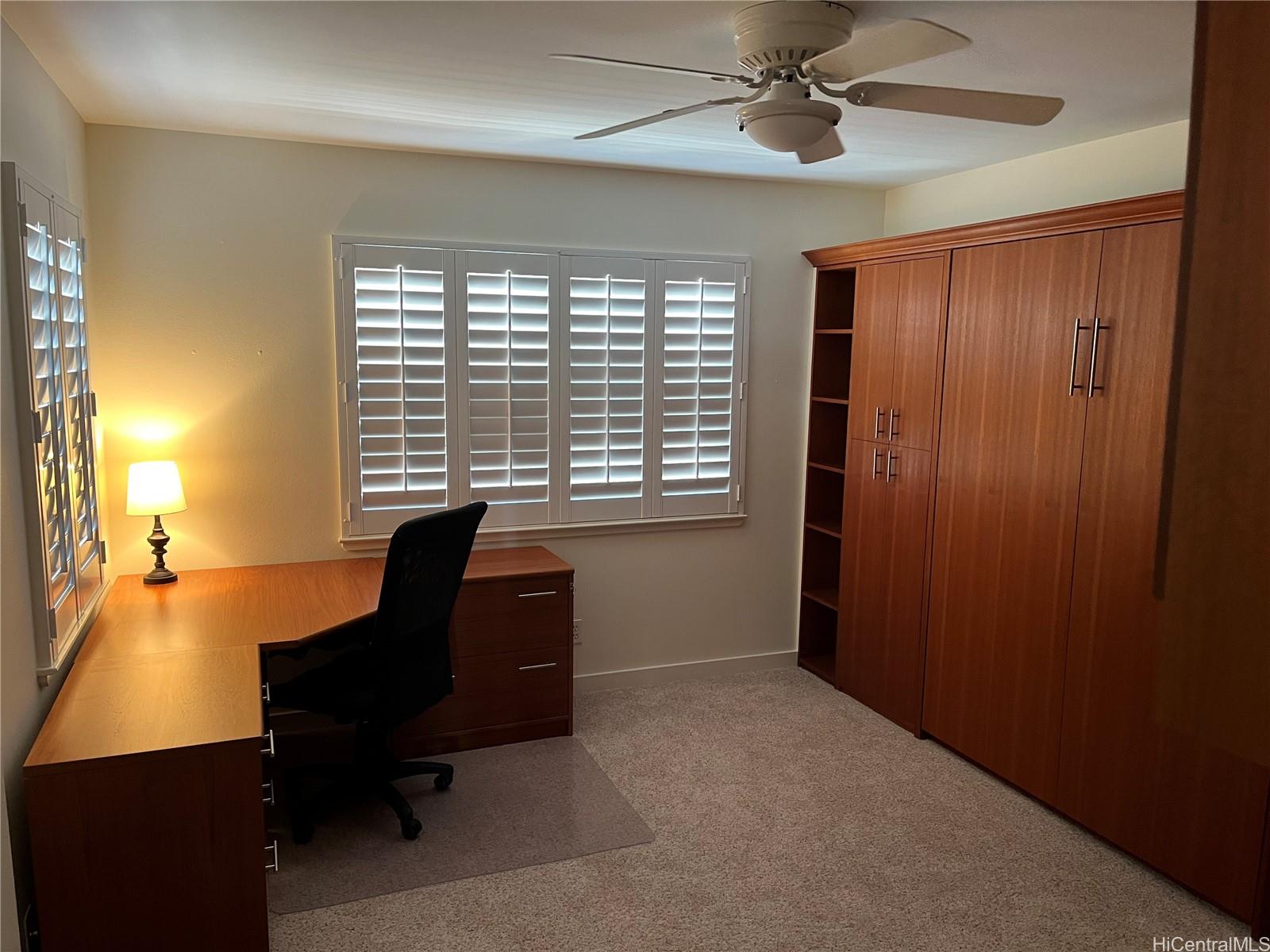 92-1001 Aliinui Drive, Unit 18C Kapolei, HI 96707 - Photo 11 of 14 a workspace with furniture and a window