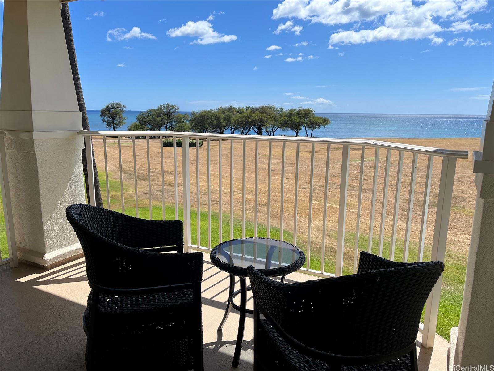 92-1001 Aliinui Drive, Unit 18C Kapolei, HI 96707 - Photo 13 of 14 a table and chairs in a patio