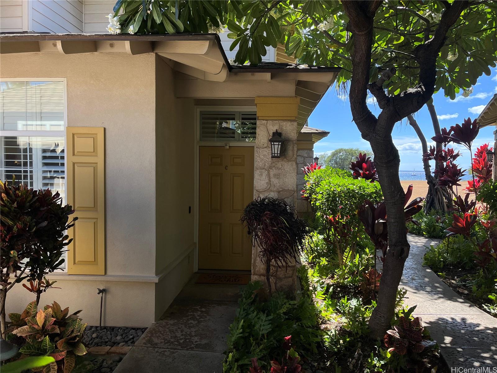 92-1001 Aliinui Drive, Unit 18C Kapolei, HI 96707 - Photo 2 of 14 a front view of a house with a yard