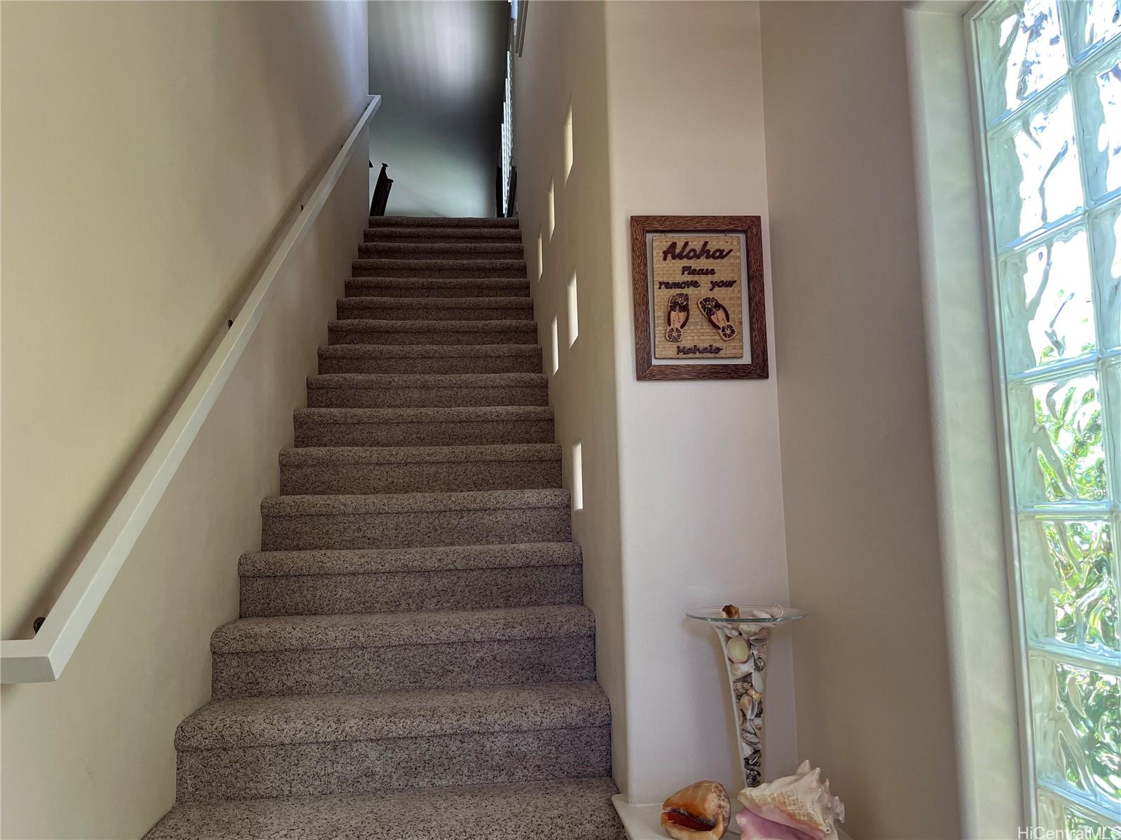 92-1001 Aliinui Drive, Unit 18C Kapolei, HI 96707 - Photo 3 of 14 a view of entryway and hall with wooden floor