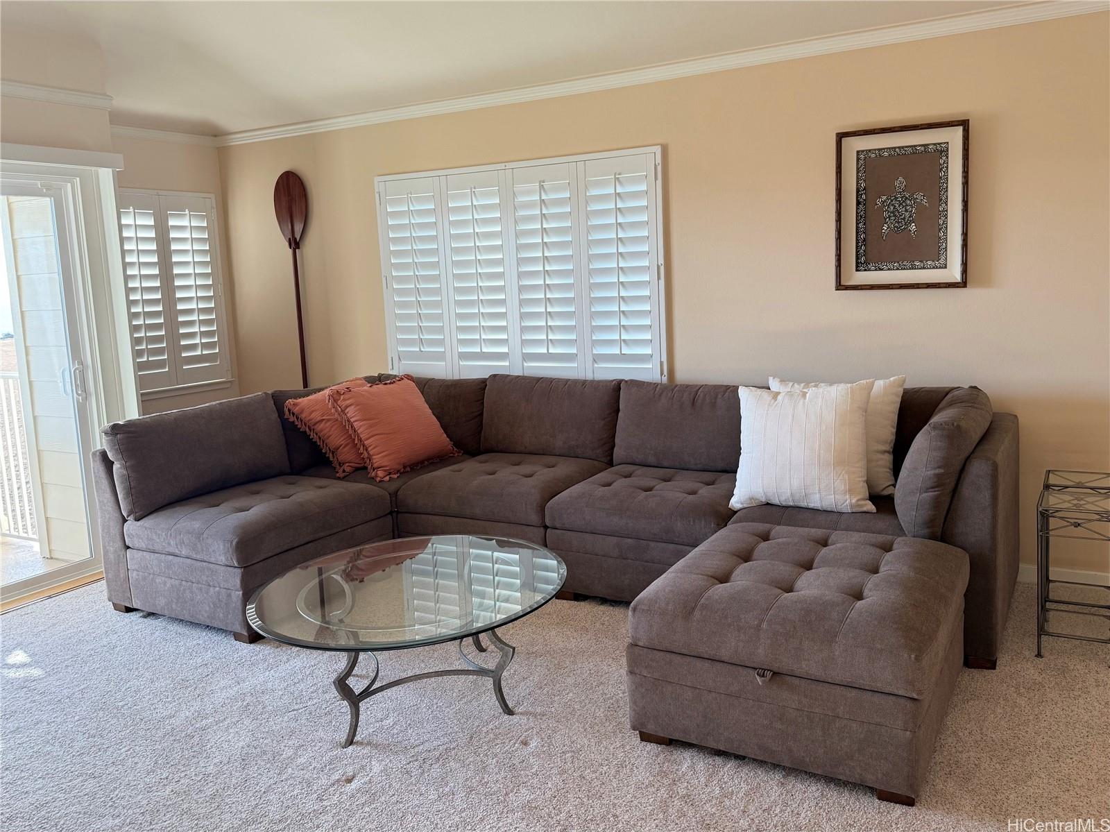 92-1001 Aliinui Drive, Unit 18C Kapolei, HI 96707 - Photo 5 of 14 a living room with furniture