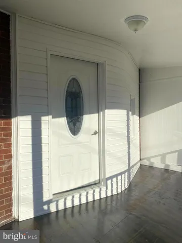a front view of a house with a large window