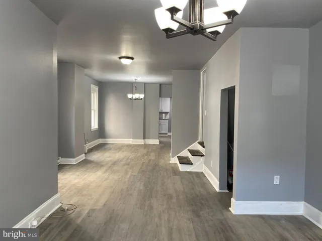 a view of a livingroom with wooden floor