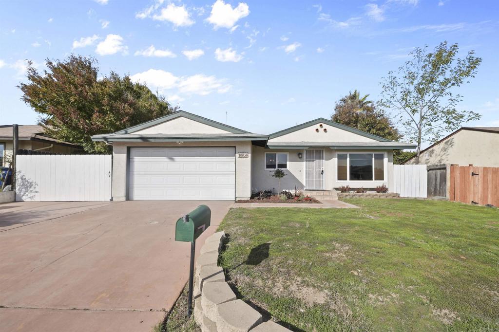 a front view of a house with yard porch and furniture