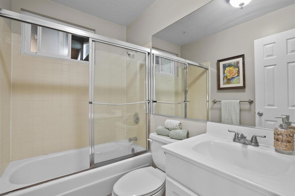 10036 3 Oaks Way Santee, CA 92071 - Photo 22 of 36 a bathroom with a sink toilet and shower
