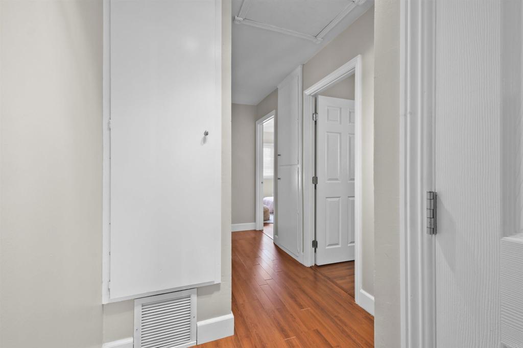 10036 3 Oaks Way Santee, CA 92071 - Photo 24 of 36 a view of a hallway with wooden floor