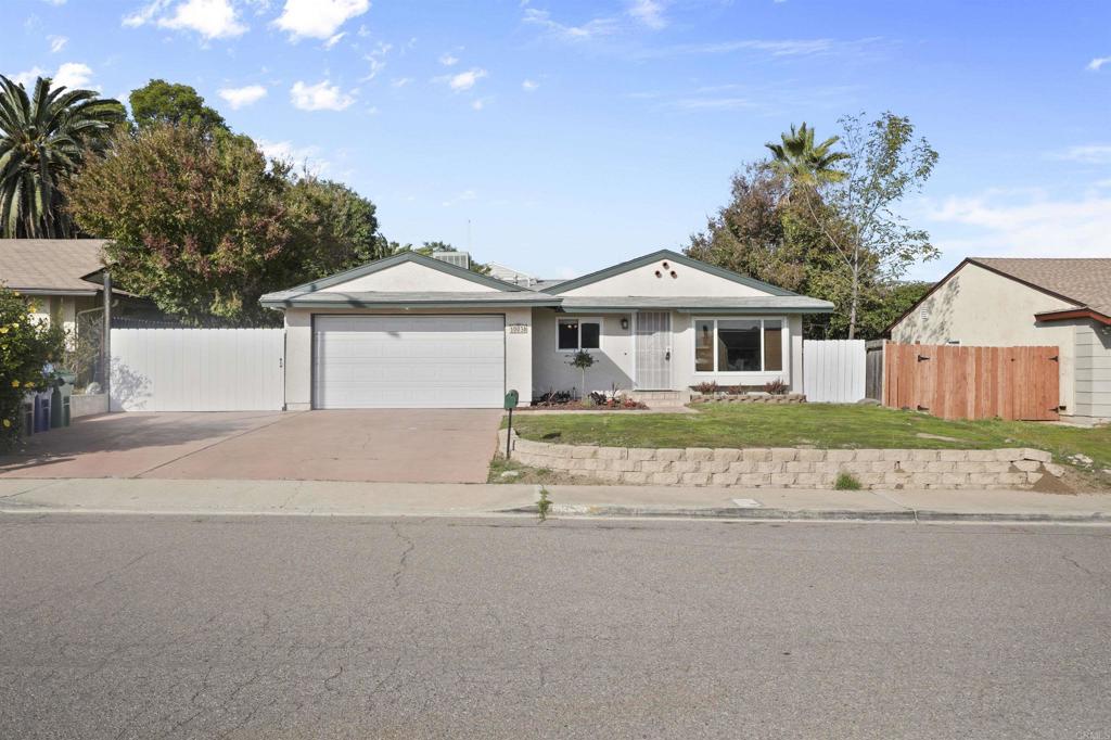 10036 3 Oaks Way Santee, CA 92071 - Photo 4 of 36 front view of a house with a garden