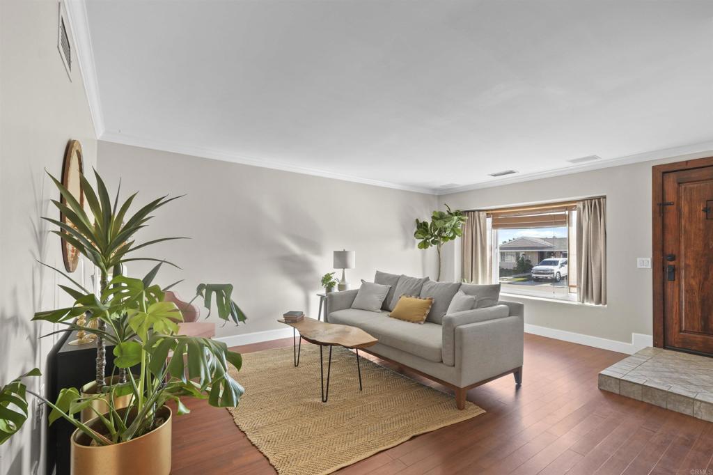 10036 3 Oaks Way Santee, CA 92071 - Photo 7 of 36 a living room with furniture potted plant and a window