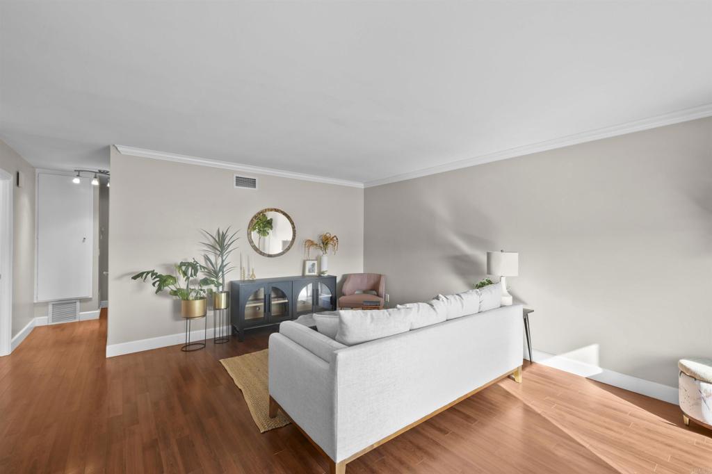 10036 3 Oaks Way Santee, CA 92071 - Photo 9 of 36 a living room with furniture and a wooden floor
