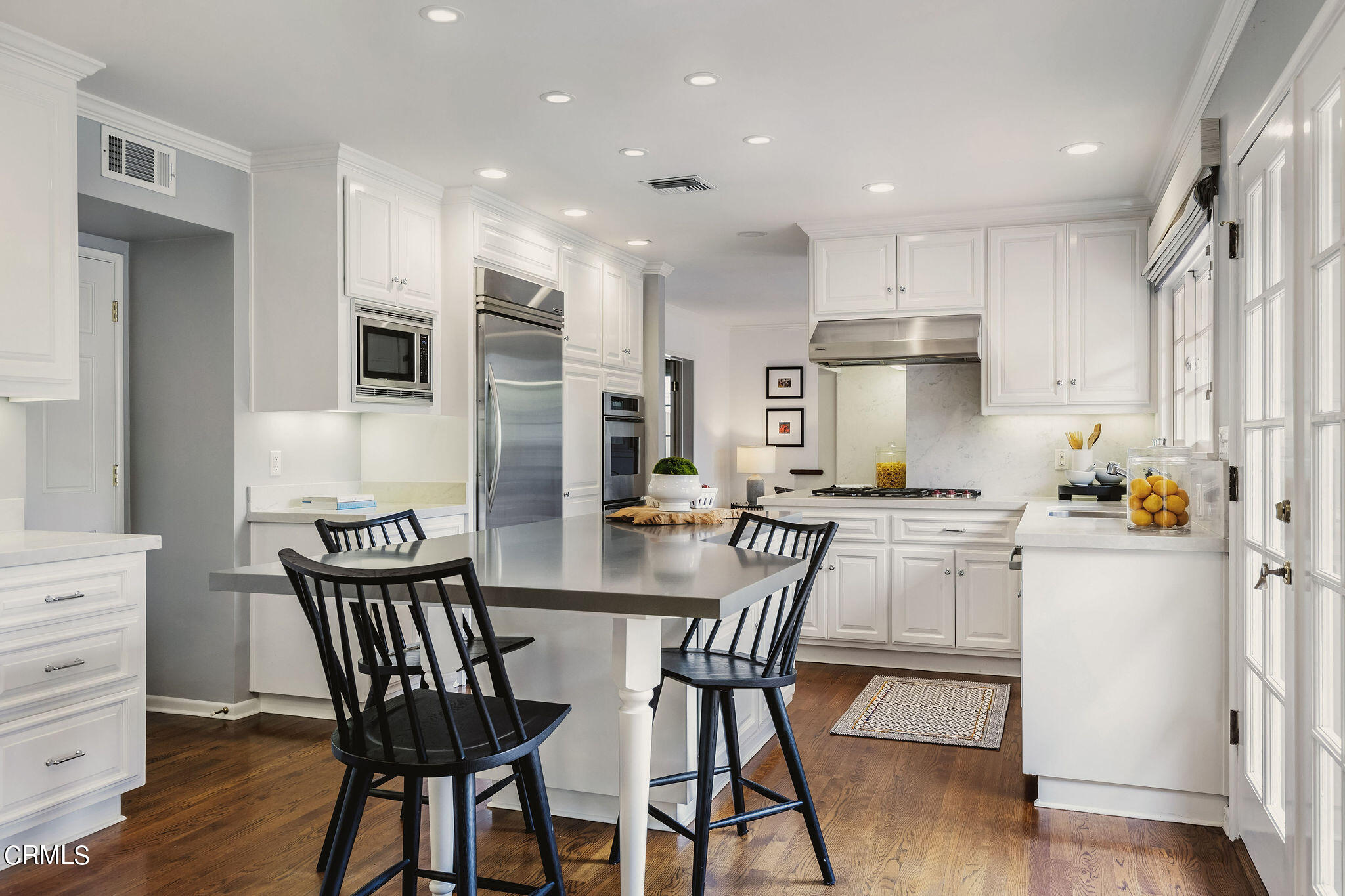 1100 Hermosa Road Pasadena, CA 91105 - Photo 4 of 17 a kitchen with stainless steel appliances kitchen island granite countertop a dining table chairs and sink