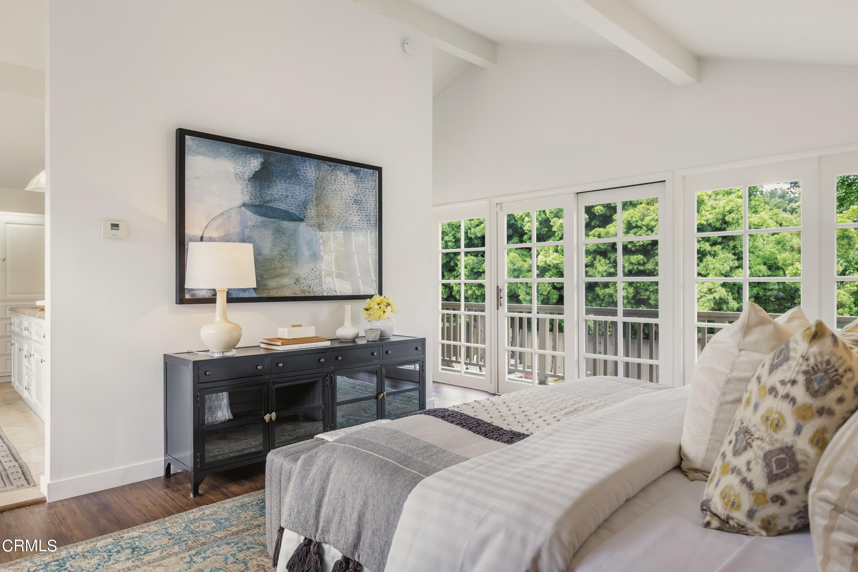 1100 Hermosa Road Pasadena, CA 91105 - Photo 6 of 17 a bedroom with a balcony a bed and a table in it