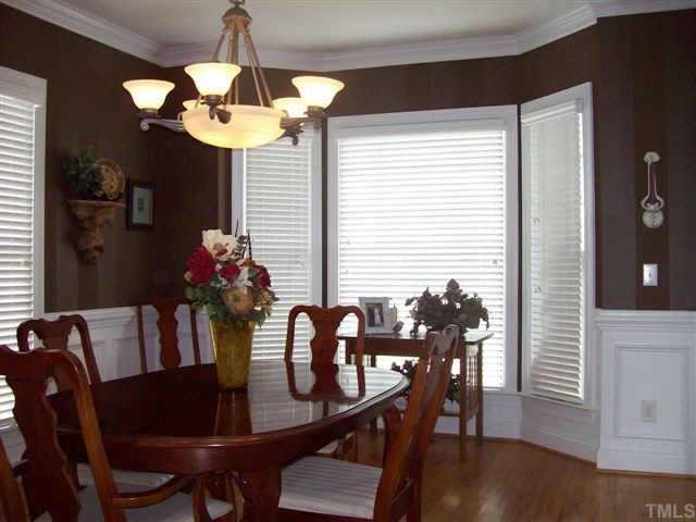 435 Competition Raleigh, NC 27603 - Photo 4 of 5 a view of a dining room with furniture and wooden floor