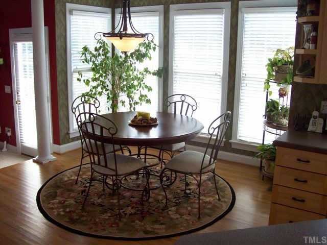 435 Competition Raleigh, NC 27603 - Photo 5 of 5 a view of a dining room with furniture window and wooden floor