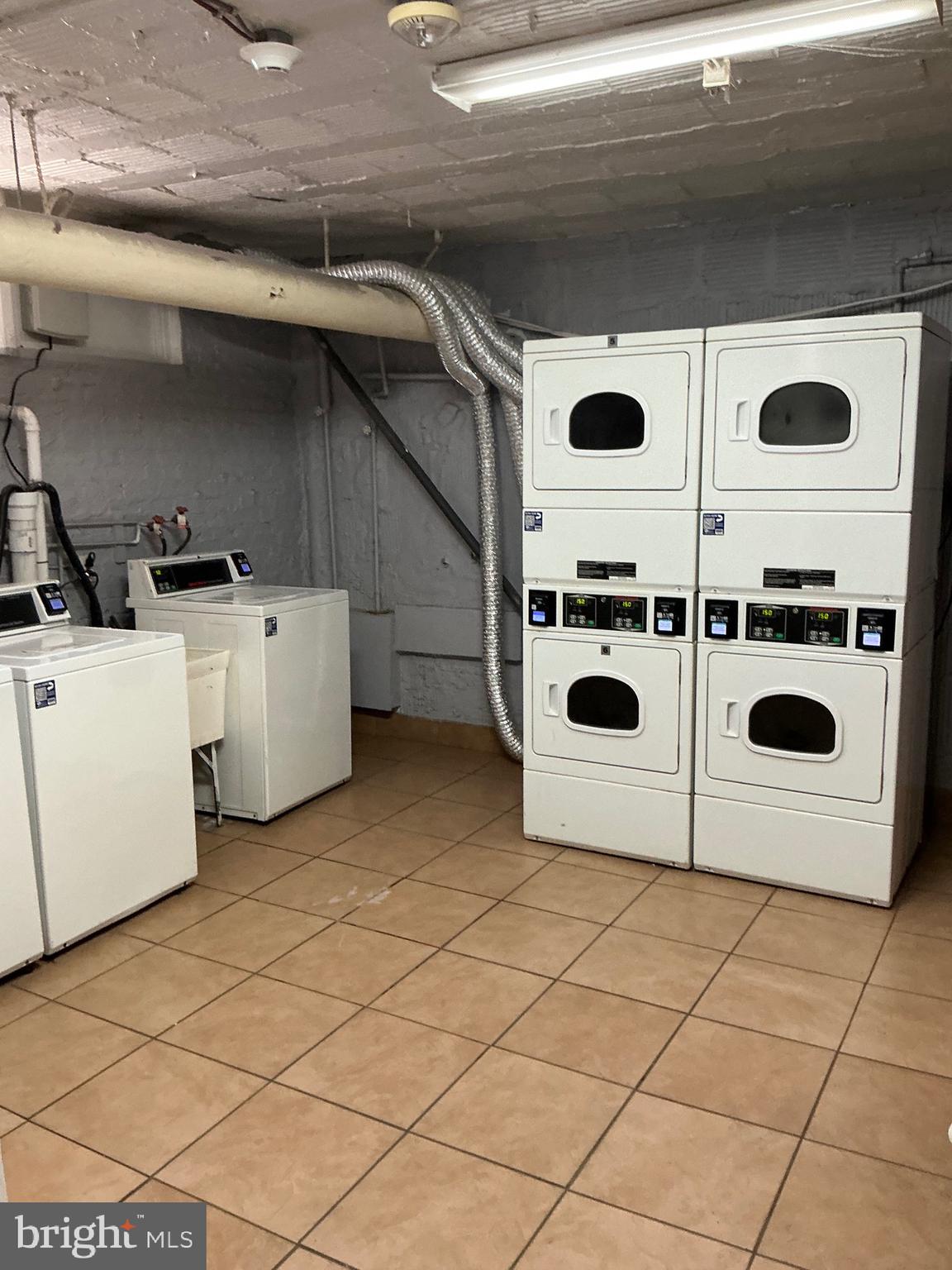 1457 Park Road Northwest, Unit 107 Washington, DC 20010 - Photo 33 of 42 Shared laundry in the basement
