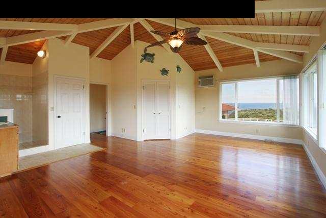 342 Kulike Road, Unit 1 Haiku, HI 96708 - Photo 14 of 30 a view of an empty room with wooden floor and a window