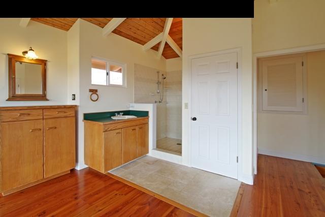 342 Kulike Road, Unit 1 Haiku, HI 96708 - Photo 22 of 30 a kitchen with granite countertop a sink and cabinets