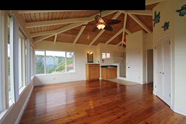 342 Kulike Road, Unit 1 Haiku, HI 96708 - Photo 25 of 30 a view of an empty room with wooden floor and a window