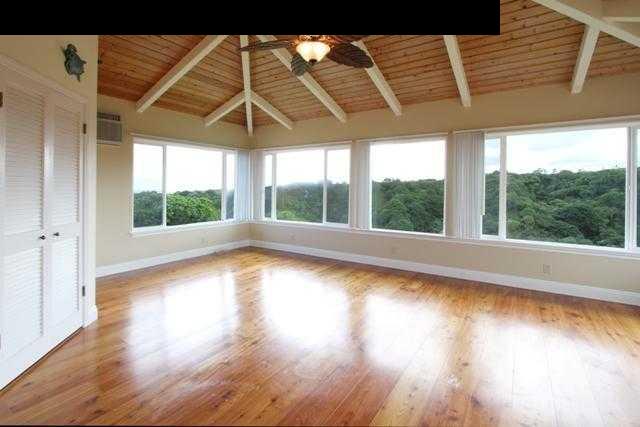 342 Kulike Road, Unit 1 Haiku, HI 96708 - Photo 4 of 30 a view of a room with wooden floor and a large window
