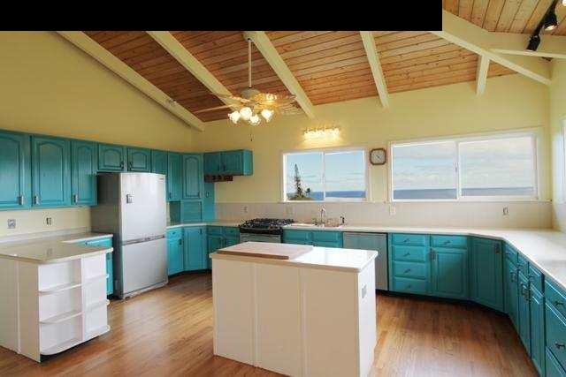342 Kulike Road, Unit 1 Haiku, HI 96708 - Photo 7 of 30 a kitchen with a cabinets and wooden floor