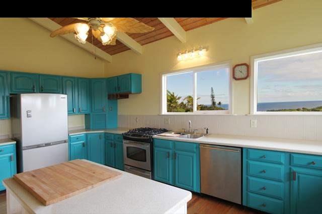 342 Kulike Road, Unit 1 Haiku, HI 96708 - Photo 9 of 30 a kitchen with a sink a refrigerator and a stove