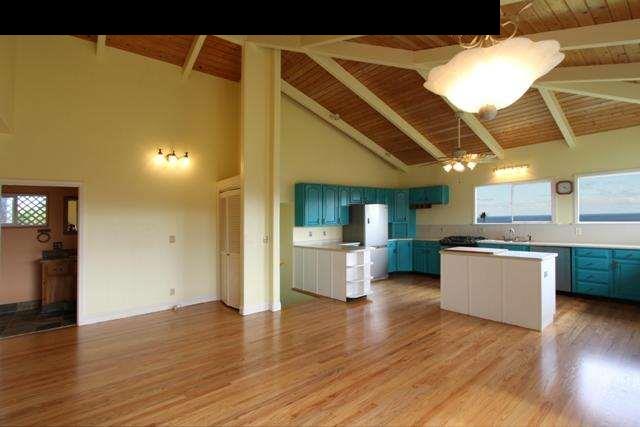 342 Kulike Road, Unit 1 Haiku, HI 96708 - Photo 10 of 30 a view of a living room with kitchen and wooden floor