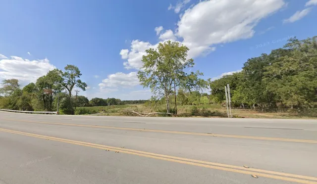 a street sign on a brick wall