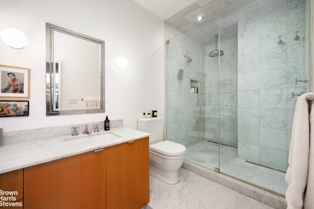 75 Livingston Street, Unit 20A Brooklyn, NY 11201 - Photo 7 of 13 a bathroom with a sink toilet and shower