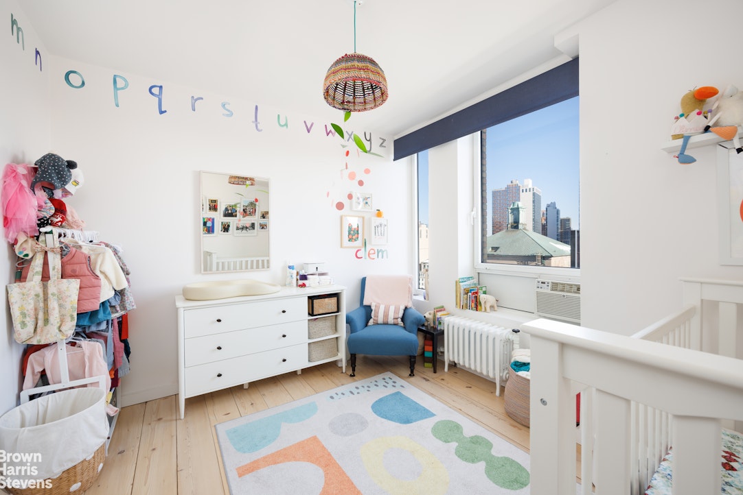 75 Livingston Street, Unit 20A Brooklyn, NY 11201 - Photo 8 of 13 a room that has a dresser and a chair in it