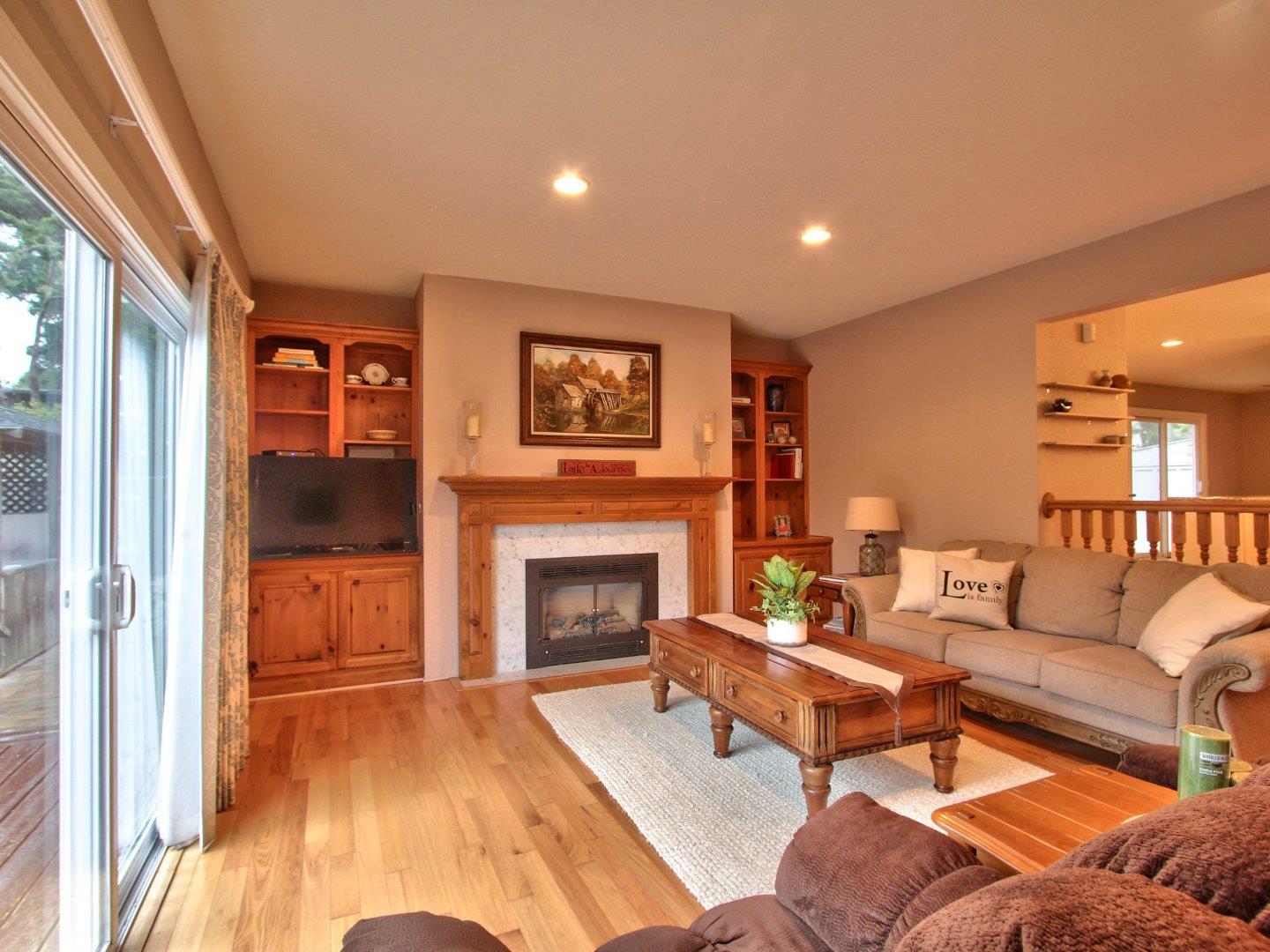 3076 Larkin Road Pebble Beach, CA 93953 - Photo 8 of 19 a living room with furniture and a fireplace