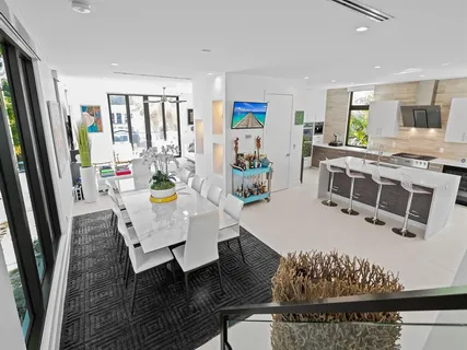a kitchen with a sink cabinets and window