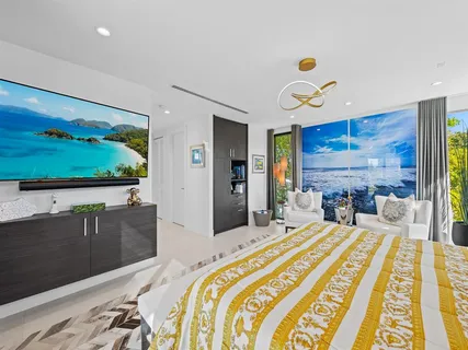 a spacious bathroom with a shower a sink and mirror