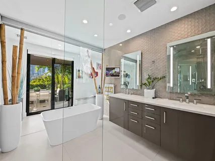 a bathroom with a bathtub and a window