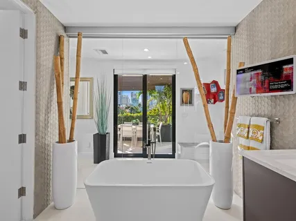 a balcony with furniture and a potted plant