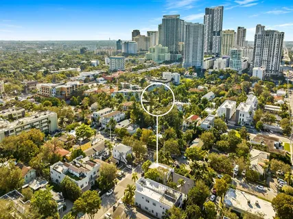 a view of a patio with table and chairs potted plants