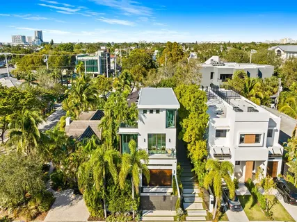 a view of entrance gate of house and tree