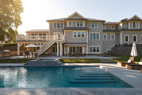 a front view of a house with swimming pool