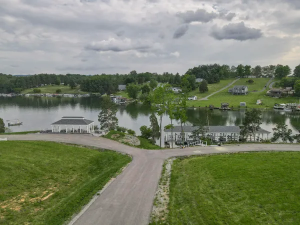 a view of a lake with houses in the back