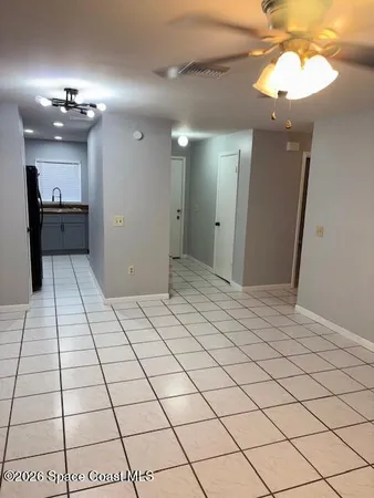 a view of a hallway and chandelier