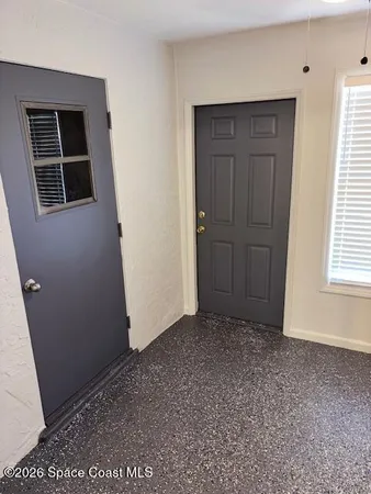 an empty room with windows