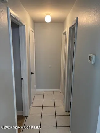 a bathroom with a shower and a mirror