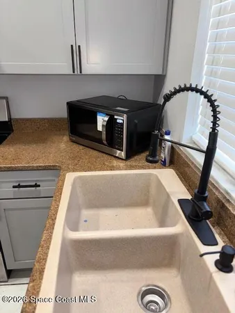 a bathroom with a sink and mirror