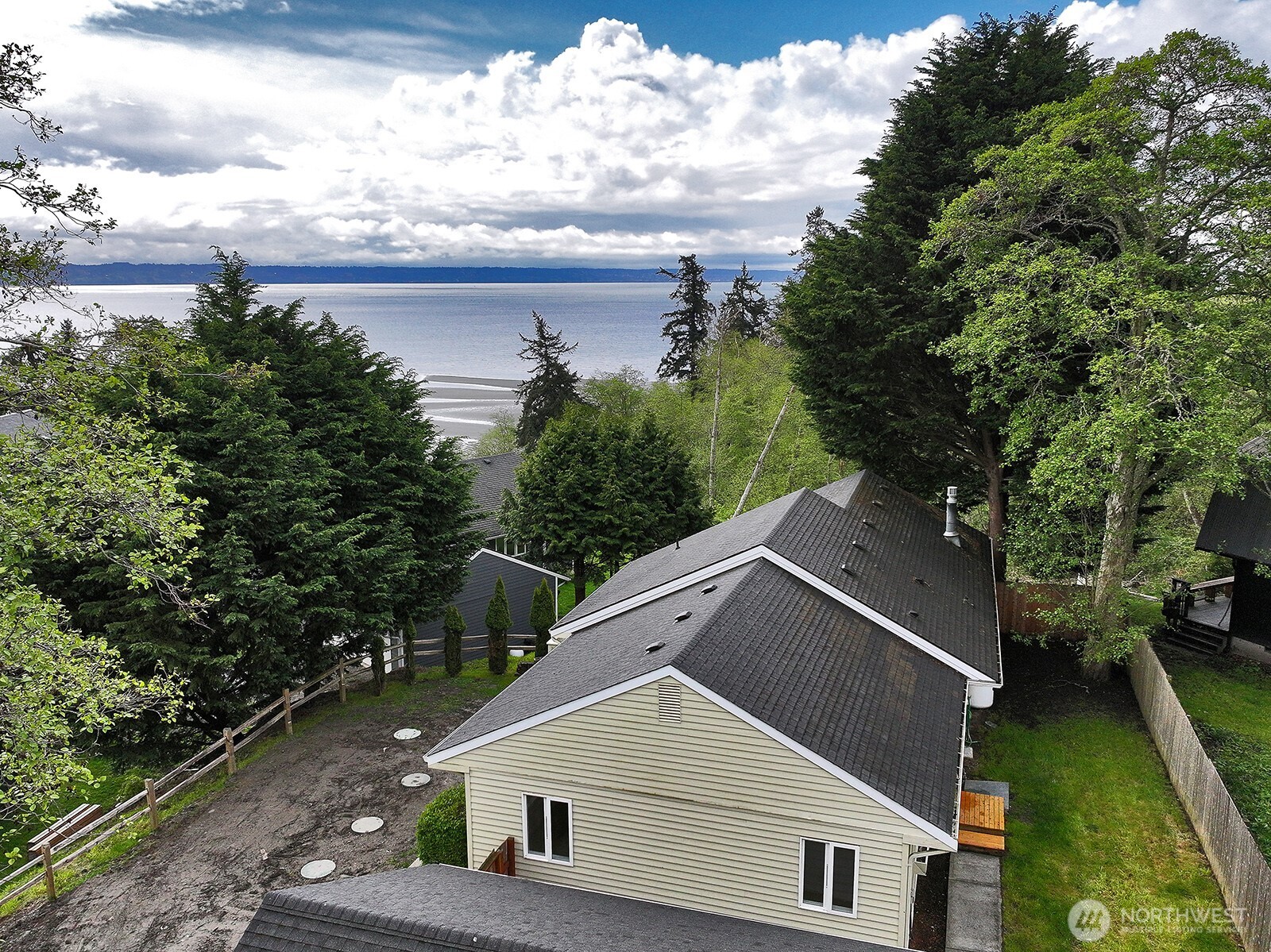 3760 Periwinkle Road Clinton, WA 98236 - Photo 3 of 34 a house with trees in the background