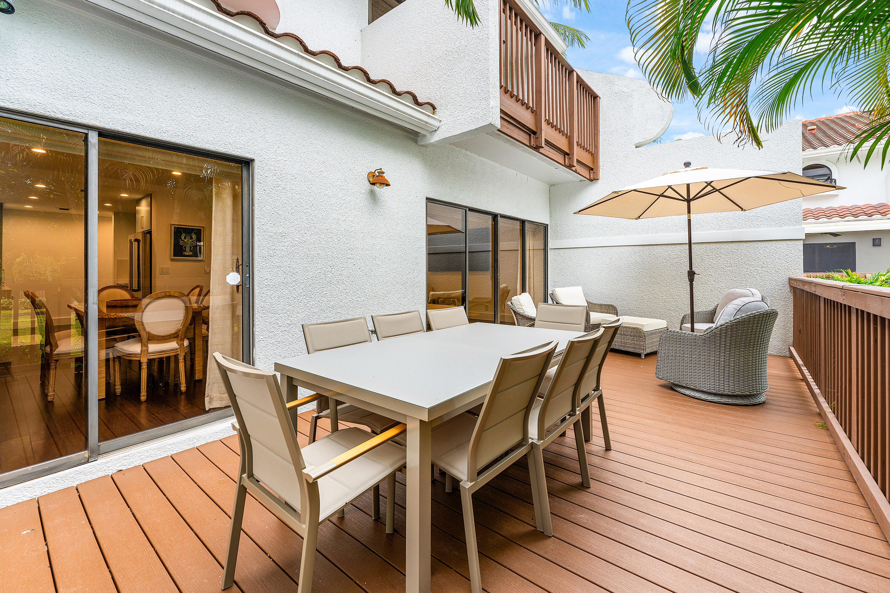 5578 North Ocean Boulevard, Unit 28F Ocean Ridge, FL 33435 - Photo 17 of 47 a view of a patio with a table and chairs